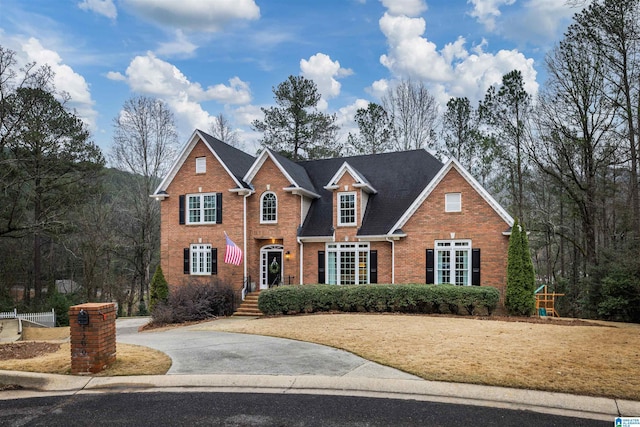 view of front of home with brick siding