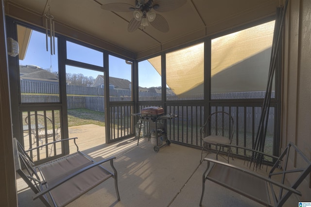 sunroom featuring a wealth of natural light and ceiling fan