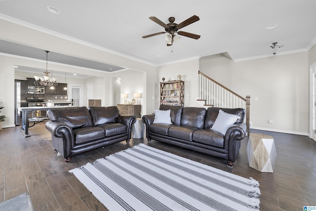 living area featuring baseboards, dark wood finished floors, stairs, crown molding, and ceiling fan with notable chandelier