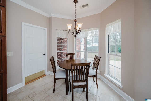 dining area with crown molding, an inviting chandelier, visible vents, and baseboards