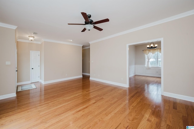 spare room featuring light wood-type flooring, baseboards, crown molding, and ceiling fan with notable chandelier