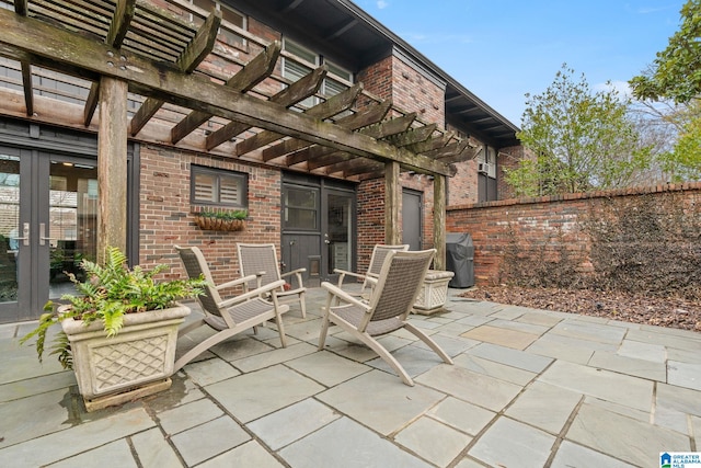 view of patio / terrace with fence and a pergola