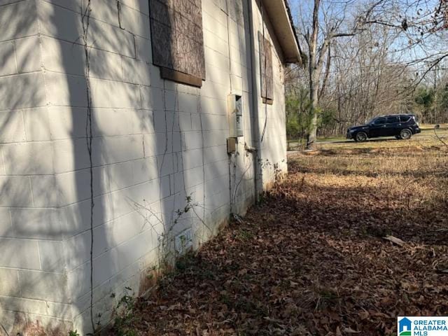 view of side of property featuring concrete block siding