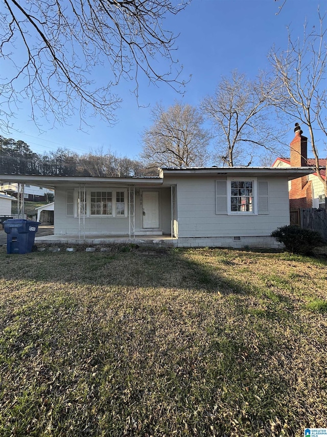 ranch-style home with a chimney, crawl space, and a front yard