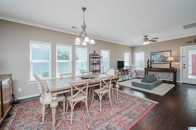 dining space featuring ornamental molding, dark wood-style flooring, visible vents, and baseboards