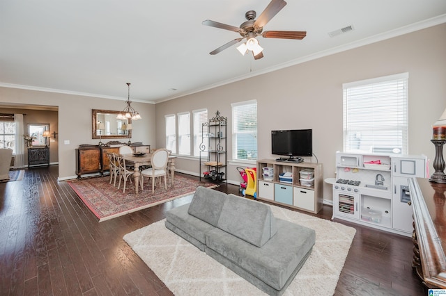 living area featuring a wealth of natural light, dark wood finished floors, and baseboards