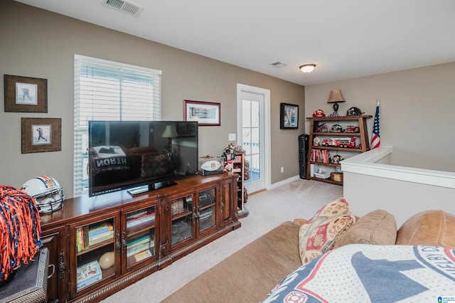 bedroom featuring baseboards, visible vents, and carpet flooring