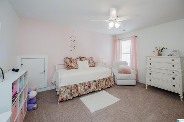 carpeted bedroom with visible vents and a ceiling fan