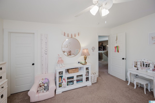 playroom featuring a ceiling fan and carpet