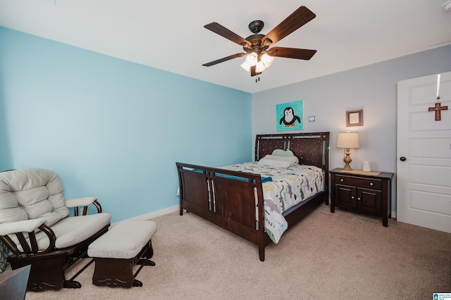 bedroom with light carpet and a ceiling fan