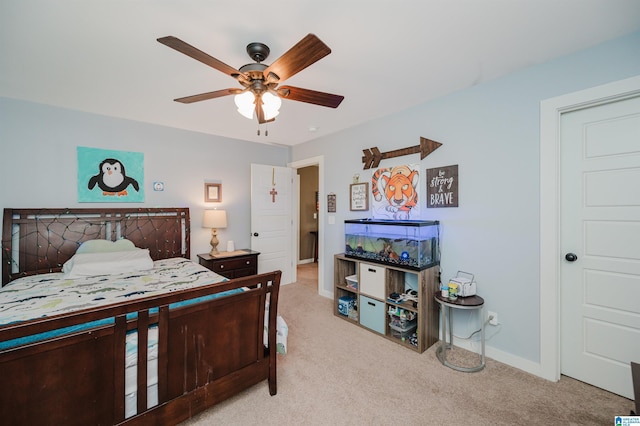 bedroom with carpet flooring, a ceiling fan, and baseboards