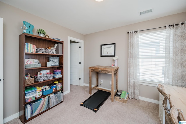 exercise area featuring carpet, visible vents, and baseboards