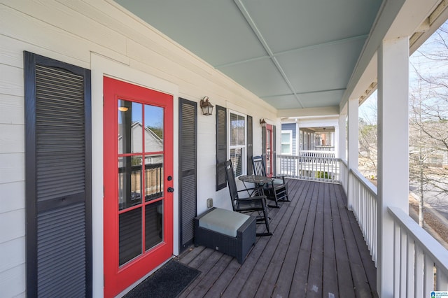 wooden terrace with a porch