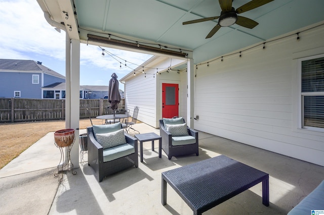 view of patio / terrace with ceiling fan, outdoor dining area, an outdoor hangout area, and fence