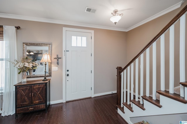 entryway featuring ornamental molding, wood finished floors, visible vents, and stairs