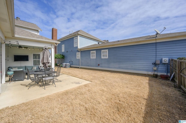 rear view of house featuring a patio, central AC, fence, ceiling fan, and an outdoor living space