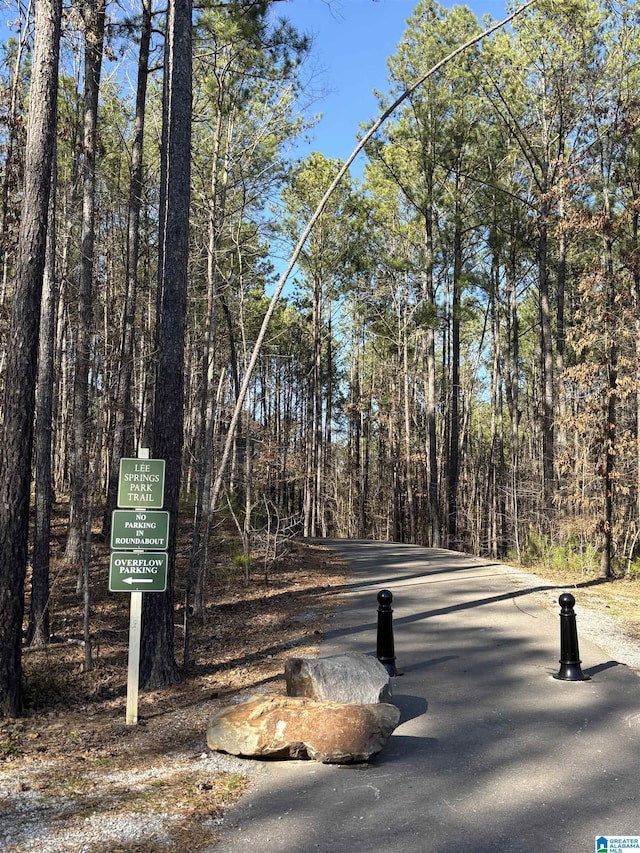 view of street featuring a forest view