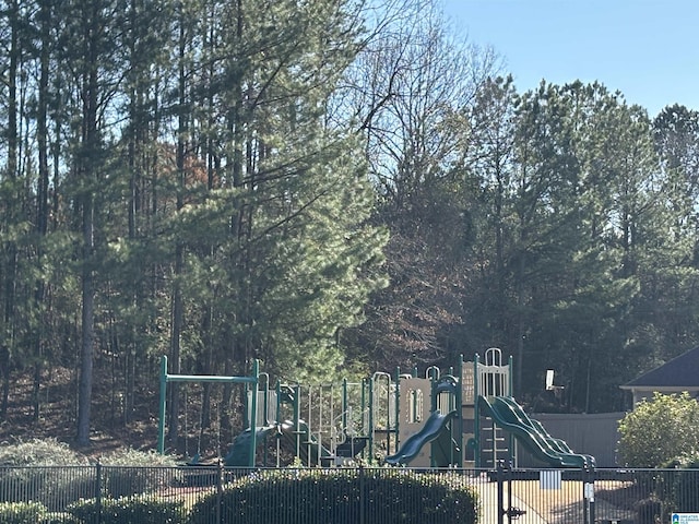 community jungle gym featuring fence