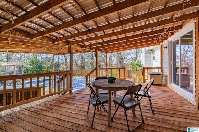 wooden terrace featuring outdoor dining space