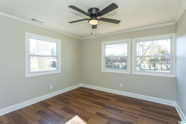 unfurnished room featuring baseboards, visible vents, dark wood-type flooring, and a wealth of natural light