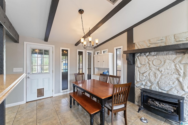 dining space with baseboards, vaulted ceiling with beams, a fireplace, a notable chandelier, and light tile patterned flooring