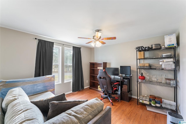 office with ceiling fan, baseboards, and wood finished floors