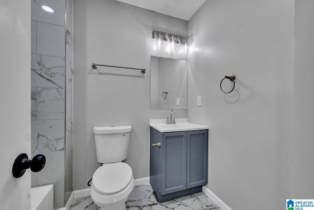 full bath featuring marble finish floor, toilet, vanity, and baseboards