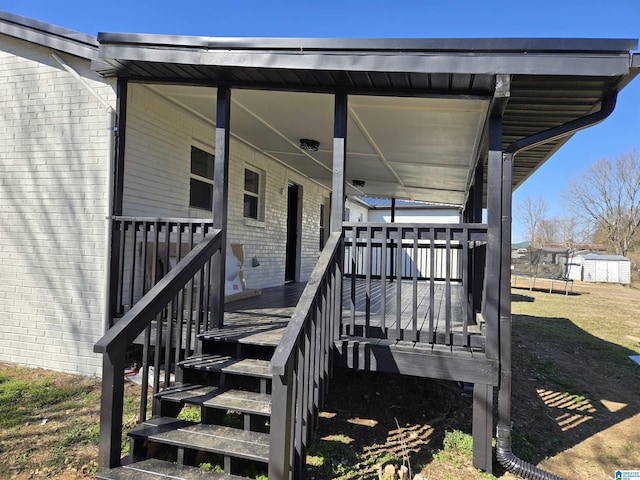 doorway to property with brick siding