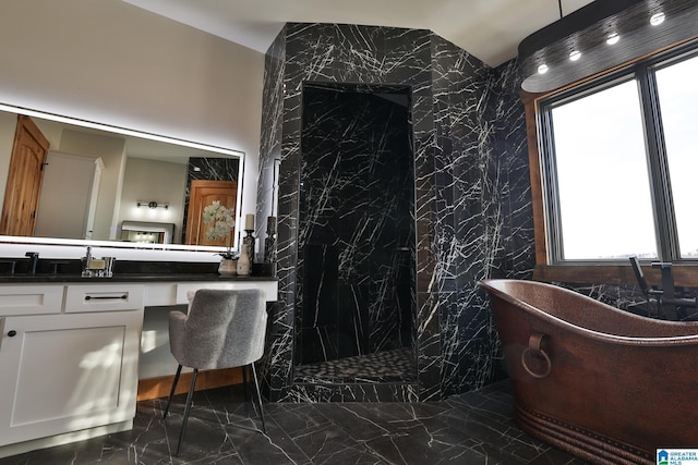 bathroom with a freestanding tub, a marble finish shower, marble finish floor, and vanity