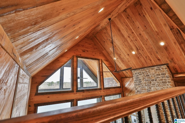 additional living space featuring lofted ceiling and wooden walls