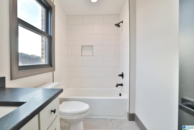 bathroom with tub / shower combination, vanity, toilet, and tile patterned floors