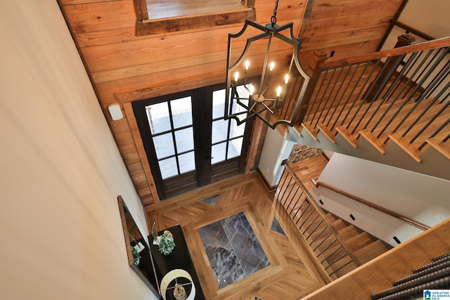 foyer entrance featuring a notable chandelier