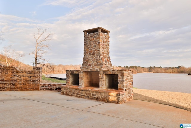 view of patio with a water view