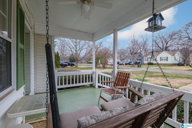 view of patio with ceiling fan, a residential view, and a porch