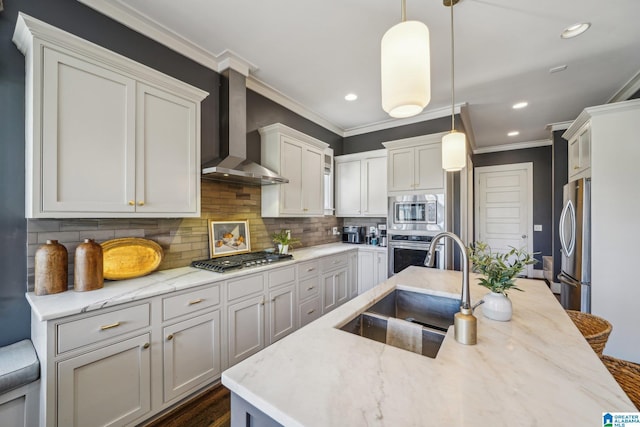 51 Nolen St, Birmingham, AL 35242 - kitchen with pendant lighting, stainless steel appliances, decorative backsplash, a sink, and wall chimney range hood