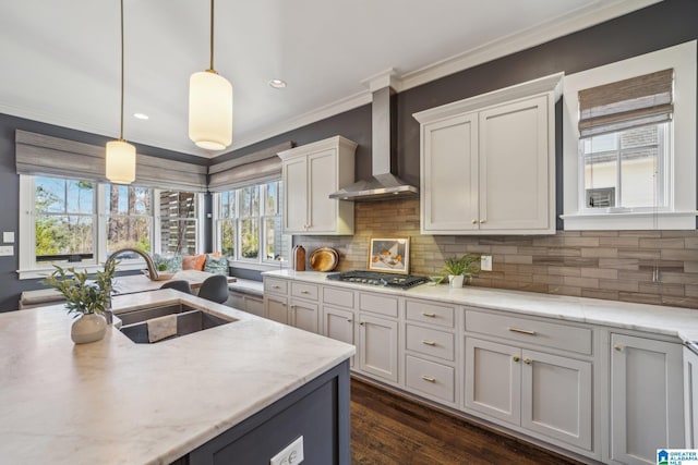 51 Nolen St, Birmingham, AL 35242 - kitchen featuring stainless steel gas cooktop, hanging light fixtures, white cabinets, a sink, and wall chimney range hood