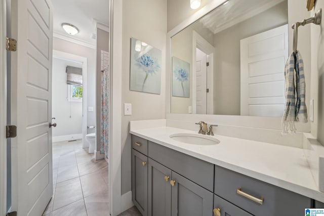 51 Nolen St, Birmingham, AL 35242 - bathroom featuring baseboards, toilet, tile patterned floors, crown molding, and vanity