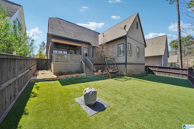 51 Nolen St, Birmingham, AL 35242 - back of house featuring a fenced backyard, a shingled roof, stairway, and a lawn