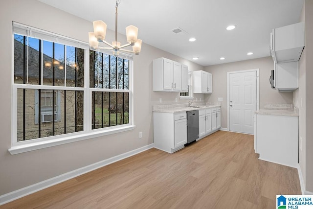 kitchen with visible vents, white cabinetry, pendant lighting, and dishwasher