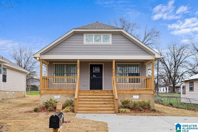 bungalow-style house featuring a porch and crawl space