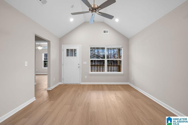 foyer featuring visible vents, light wood-style floors, vaulted ceiling, ceiling fan, and baseboards