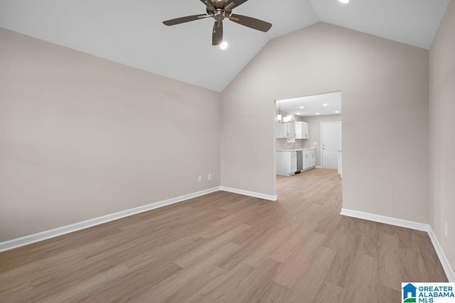 interior space with high vaulted ceiling, recessed lighting, a ceiling fan, baseboards, and light wood-style floors