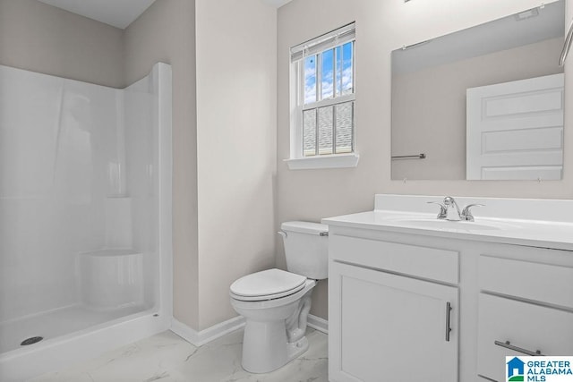 bathroom with toilet, vanity, baseboards, marble finish floor, and a shower stall