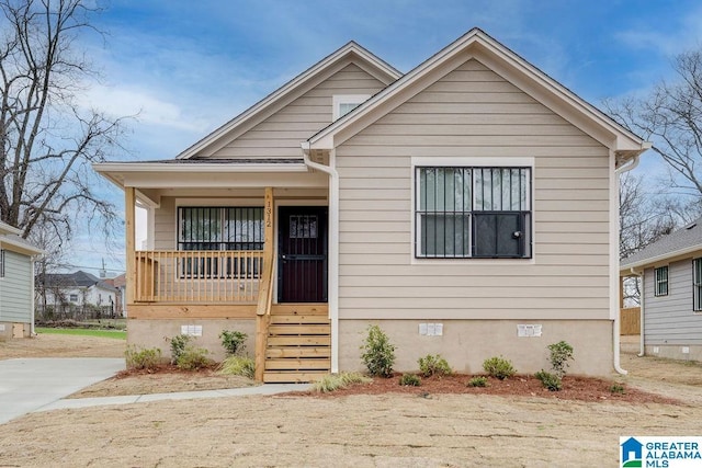 bungalow-style home featuring a porch and crawl space