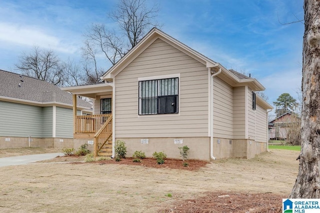 bungalow-style house with crawl space and stairway