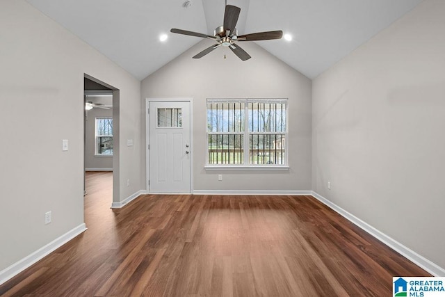 entrance foyer featuring lofted ceiling, ceiling fan, baseboards, and dark wood finished floors