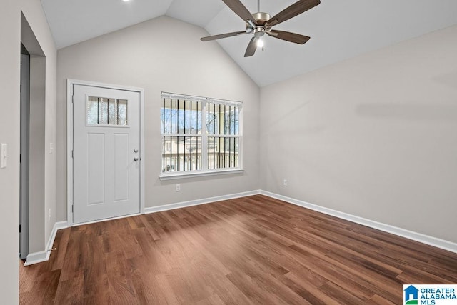 entrance foyer with ceiling fan, vaulted ceiling, baseboards, and wood finished floors