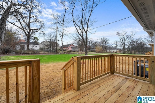 deck featuring a residential view and a yard