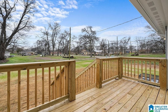 wooden deck with a yard