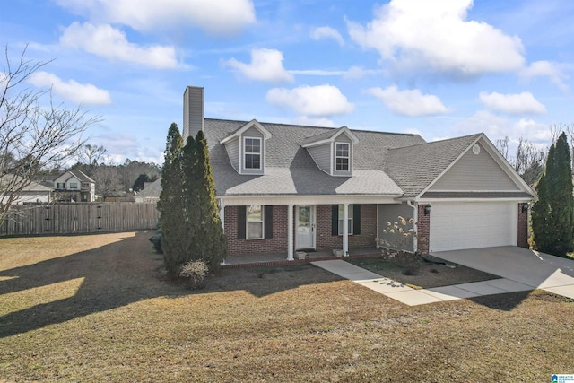 view of front of property with driveway, a garage, fence, and brick siding